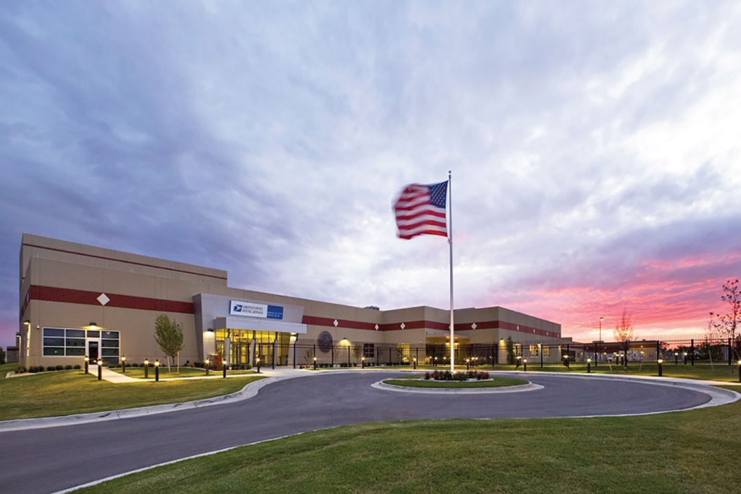 Oklahoma City United States postal service building with flag waiving outside